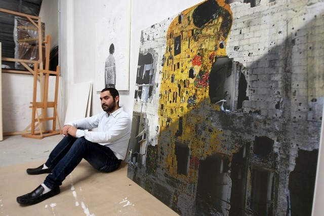 Tammam Azzam with his work, Freedom Graffiti, at Ayyam Gallery in Dubai. Pawan Singh : The National